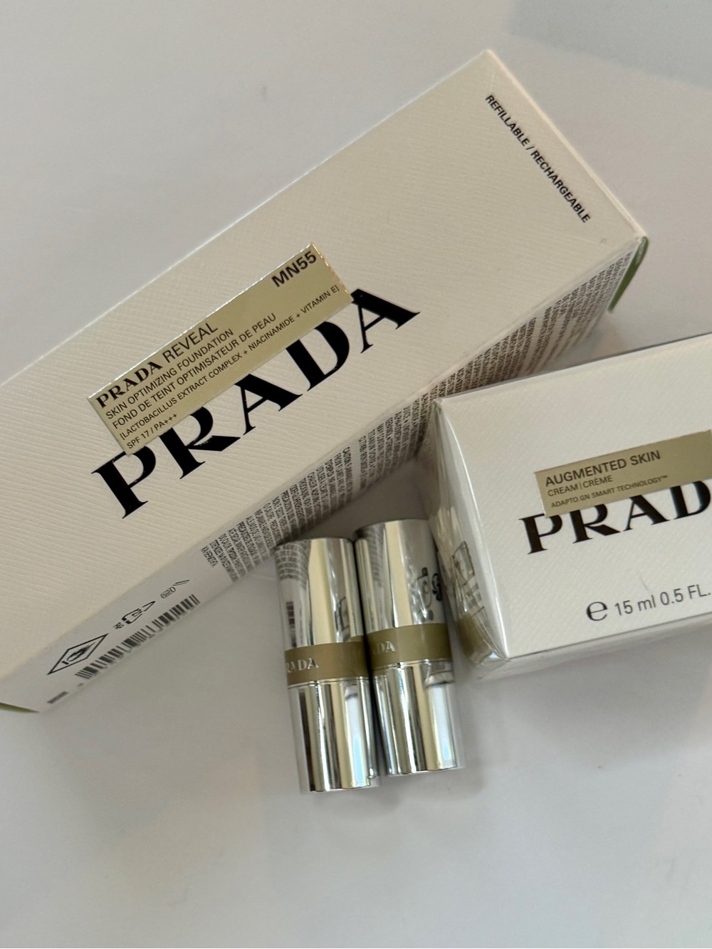 Prada Beauty Bundle NIB: Reveal Foundation, Augmented Skin Cream, 2 Banana balms